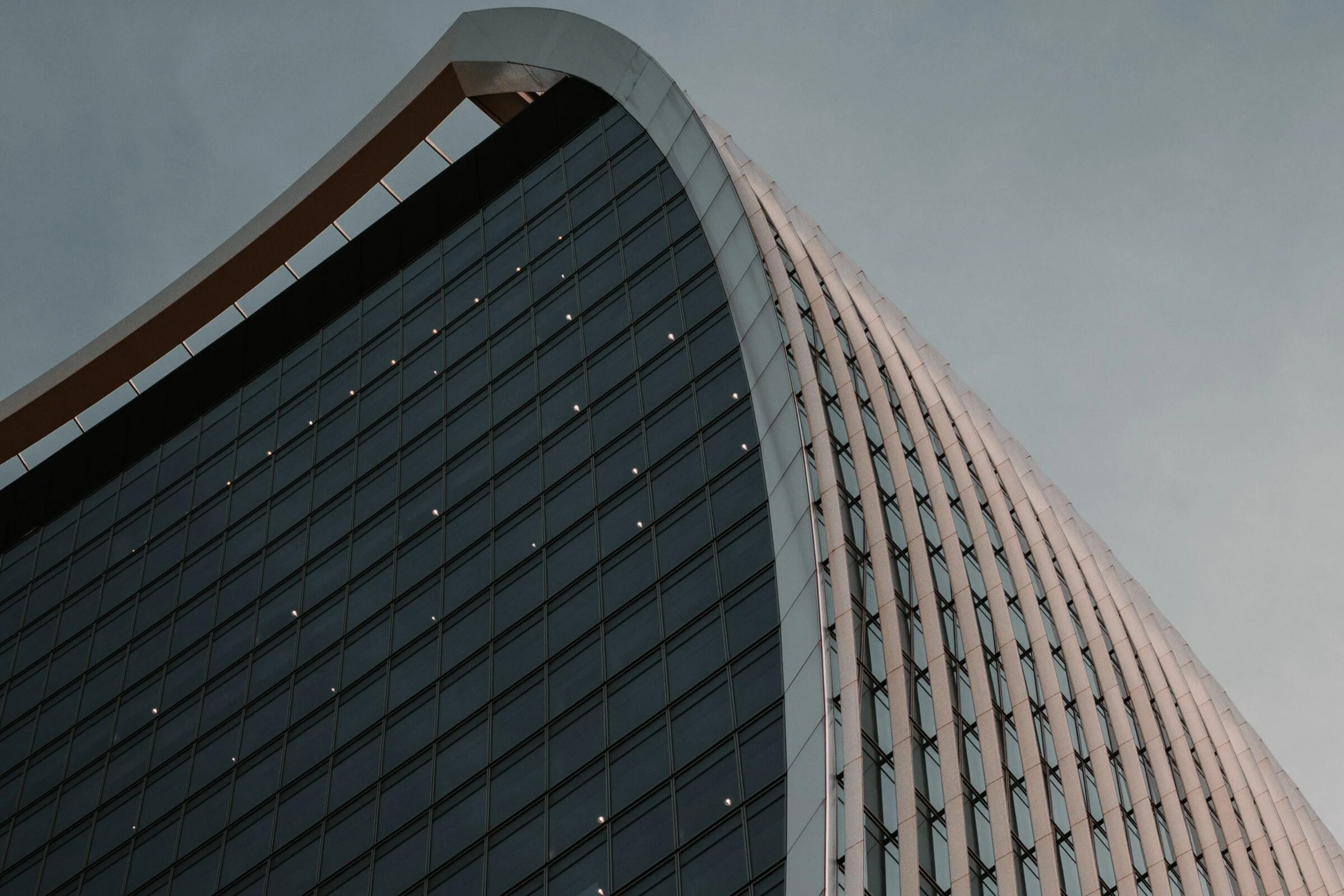 Modern office building with grey sky in background