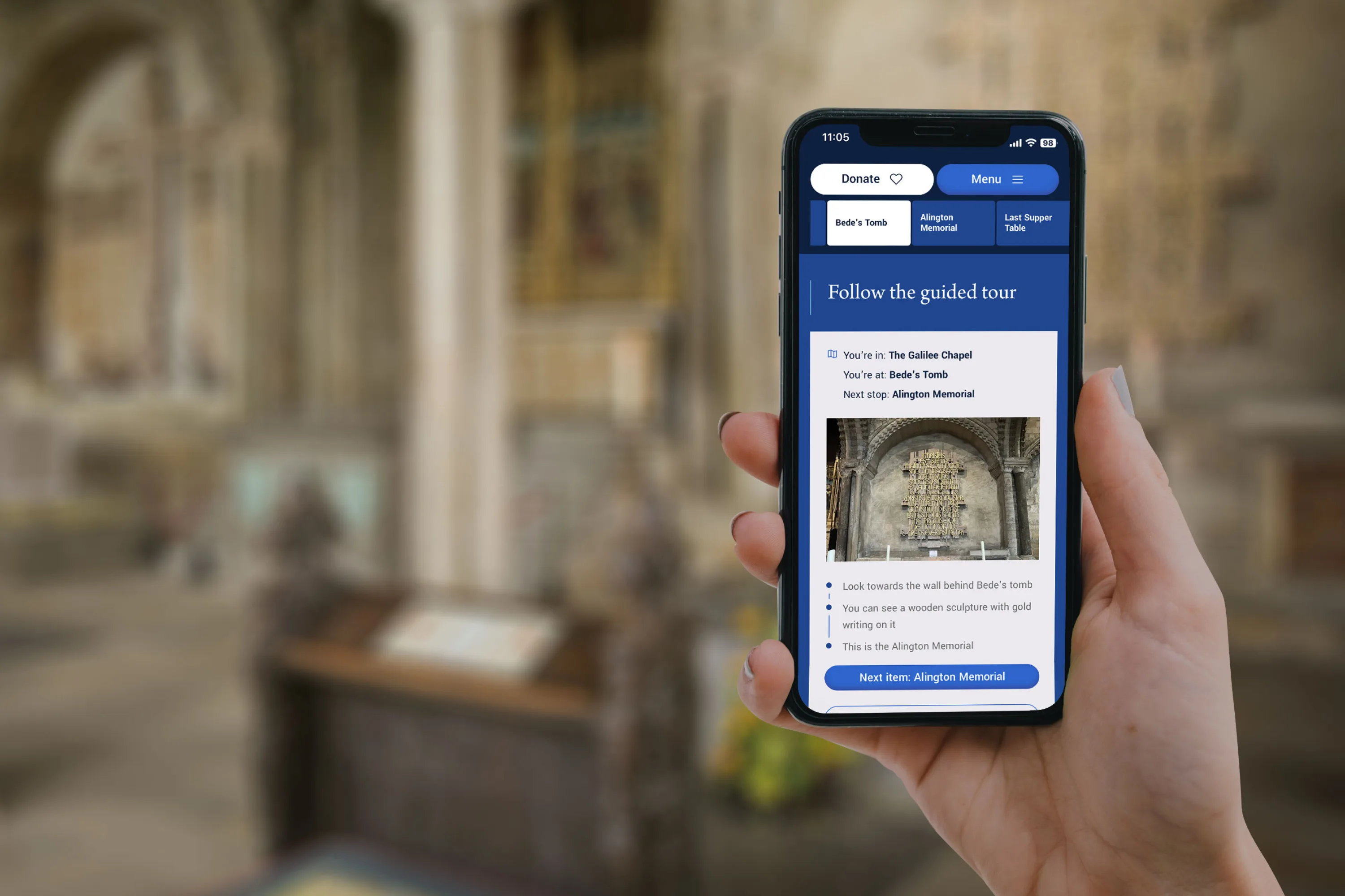Hand holding an iphone in a cathedral