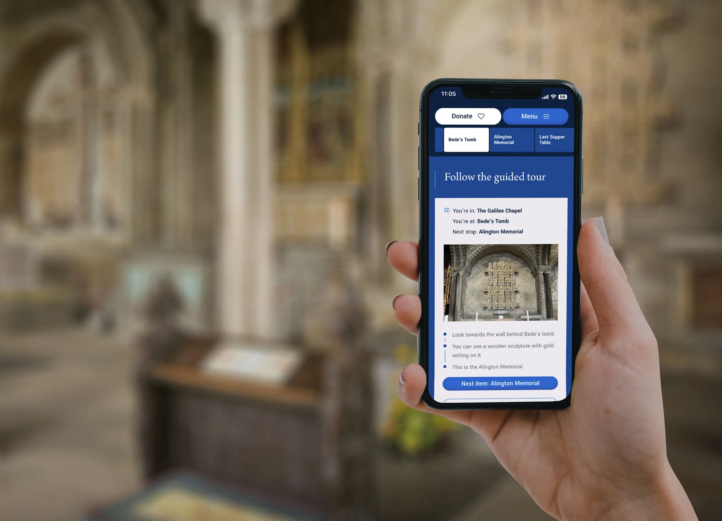 Hand holding an iphone in a cathedral