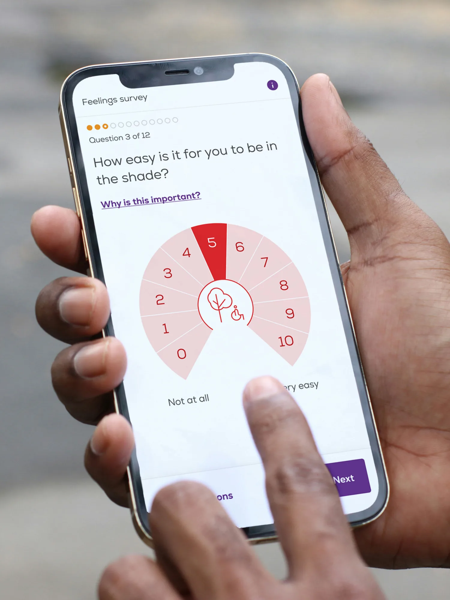 A mobile device in hand, showing an intuitive radial sliding scale interface