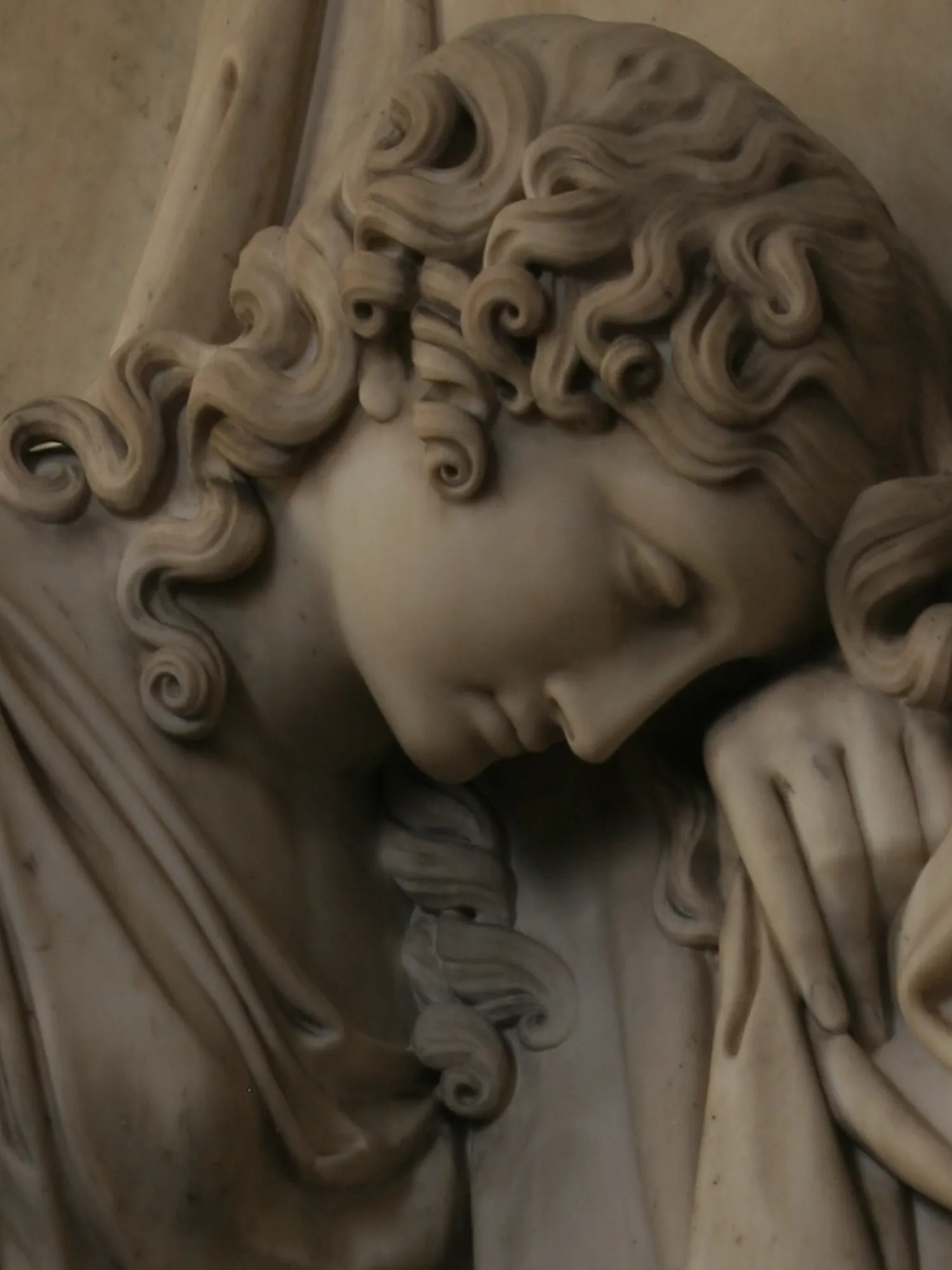 an intricately carved statue of a woman