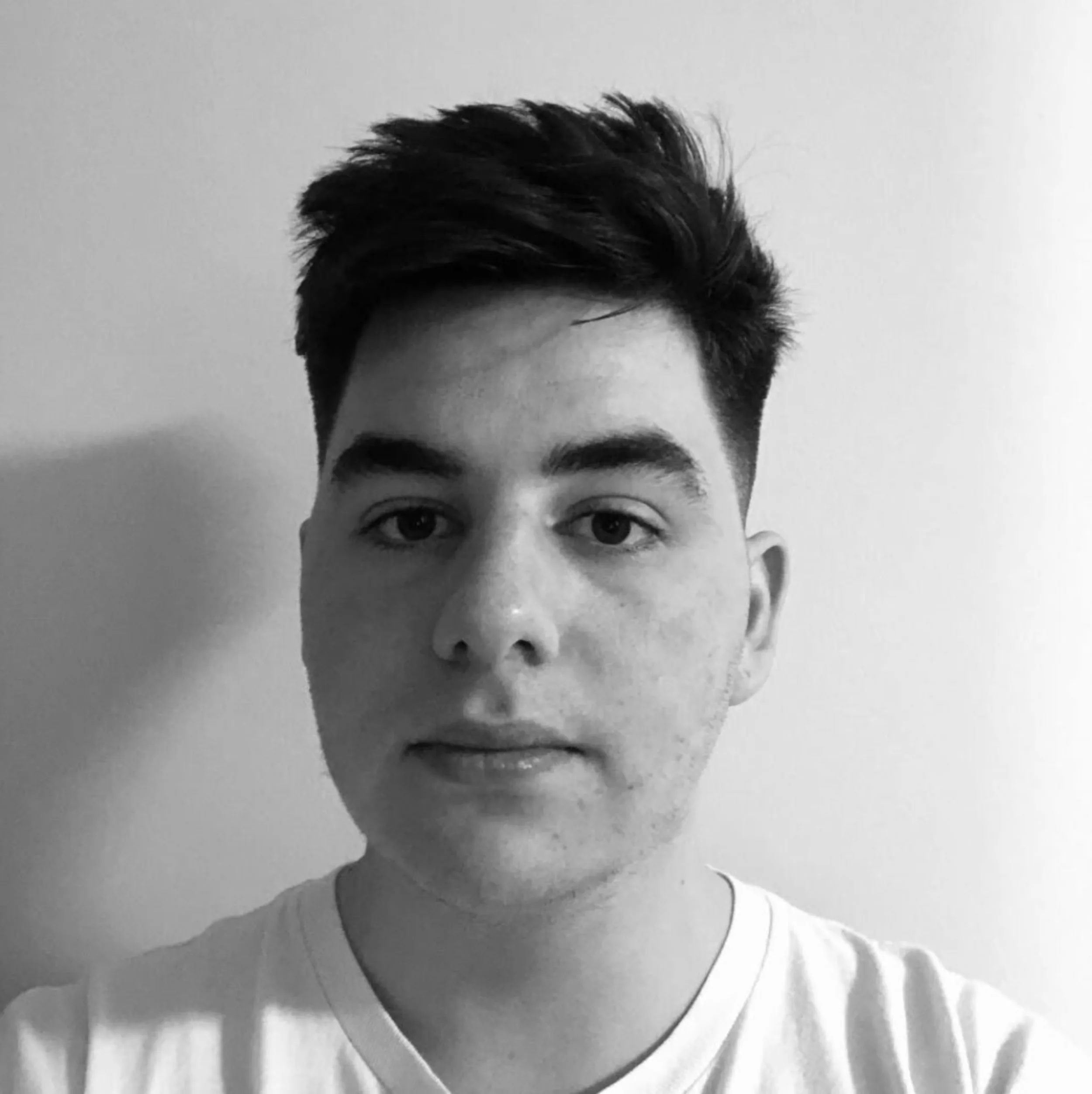 Black and white profile photo of Oli Knight