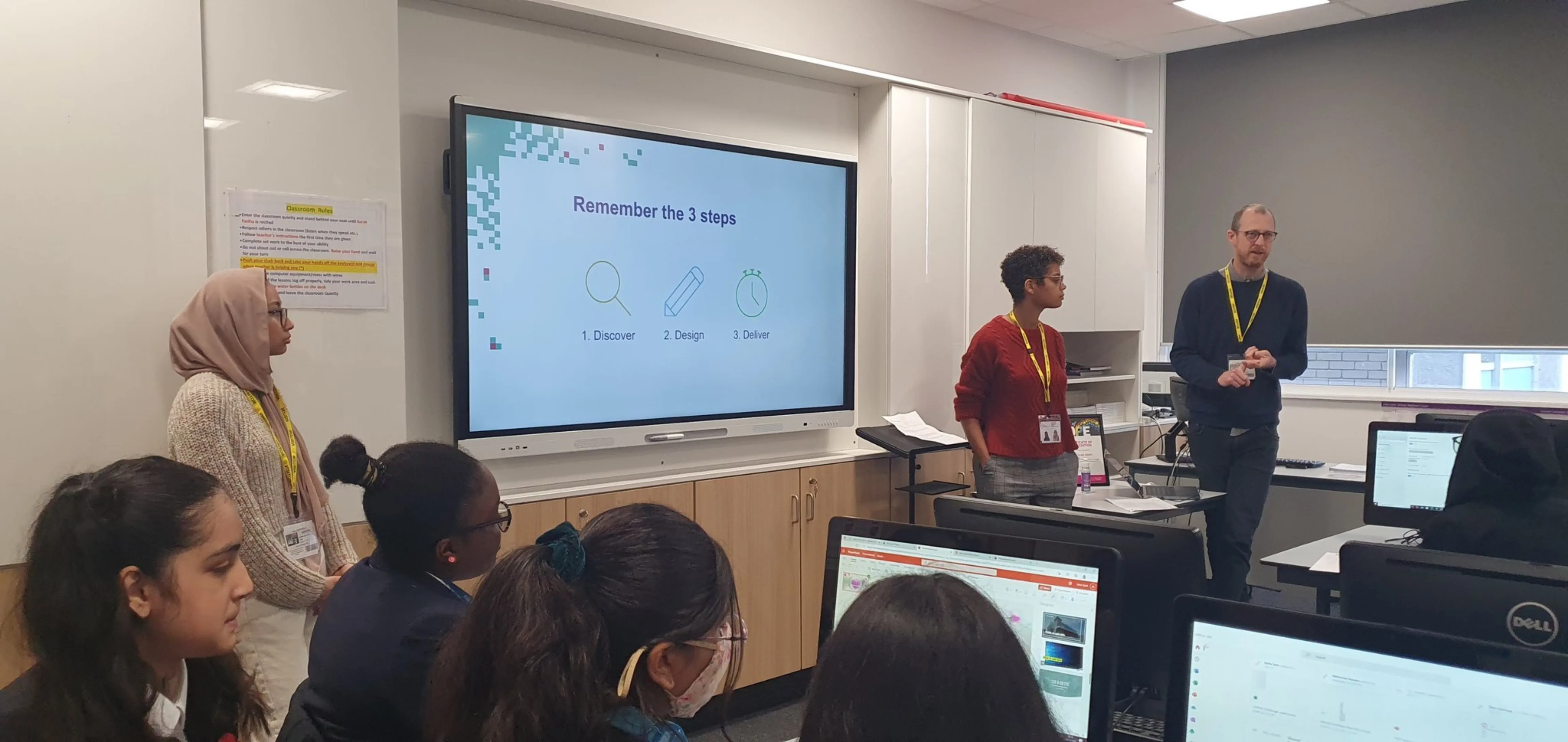 Three Ten4 team members address a class of year 9s
